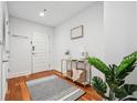 Inviting foyer with hardwood floors, a console table, and decor for a welcoming entrance at 1080 Peachtree Ne St # 2416, Atlanta, GA 30309