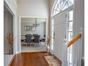 Elegant entryway with hardwood floors leading to the dining room at 5713 Brynwood Nw Cir, Acworth, GA 30101