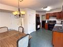 Open kitchen featuring stainless appliances, breakfast area, and lots of natural light at 3875 Ivy Run Cir, Duluth, GA 30096