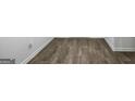 Stylish wood-look floors add a touch of modern design and easy maintenance to the home at 390 River Walk Farm Parkway Lot 47, Covington, GA 30014