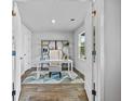 Bright office space featuring a white desk, shelving, and natural light from the window at 669 Egrets Lot 56 Lndg, Covington, GA 30014