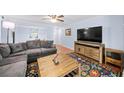 Comfortable living room featuring a large gray sectional, wood floors and neutral paint colors at 5141 Roswell Rd # 7, Atlanta, GA 30342