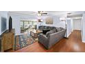 Comfortable living room featuring a large gray sectional, wood floors and neutral paint colors at 5141 Roswell Rd # 7, Atlanta, GA 30342