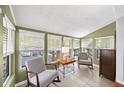 Bright sun room with lots of natural light, tile floors and comfortable seating for relaxing at 5141 Roswell Rd # 7, Atlanta, GA 30342