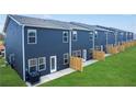 Townhome backyard featuring a privacy fence and green lawn, perfect for outdoor enjoyment and relaxation at 11569 Kimberly Way # 26, Hampton, GA 30228
