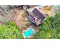 Expansive backyard boasts a large in-ground pool, outdoor seating area, and a fire pit at 1074 Fieldstone Dr, Canton, GA 30114
