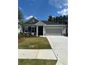 Charming one-story home with a well-manicured front yard and attached two-car garage at 2108 Amaryllis Dr, Grayson, GA 30017