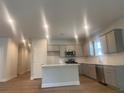 Modern kitchen features stainless steel appliances, a center island, and plenty of counter space for cooking and entertaining at 2108 Amaryllis Dr, Grayson, GA 30017
