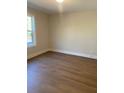 Clean and modern bedroom with wood flooring and ample natural light at 445 Firefly Cir # 40, Alpharetta, GA 30009