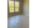 Sunlit bedroom with large windows offering a pleasant outdoor view at 445 Firefly Cir # 40, Alpharetta, GA 30009