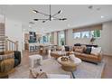 Bright living room featuring modern lighting, hardwood floors, and stylish furnishings at 114 Briargate Dr, Johns Creek, GA 30097