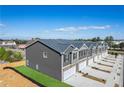 Townhomes feature attached garages, stylish exteriors, and newly landscaped front yards at 11561 Kimberly Way # 22, Hampton, GA 30228