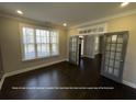 Spacious office offering hardwood floors and a front-facing window with a great view of the front yard at 13015 Fox Rd, Alpharetta, GA 30005