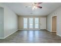 Bright living room with new floors and multiple windows for ample natural light at 1665 Dunbarton Dr, Lithonia, GA 30058