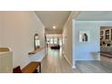 Bright foyer featuring light hardwood floors, neutral walls, and an open view to the living area at 1835 Wellston Dr, Lawrenceville, GA 30043