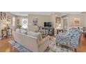 Cozy living room featuring hardwood floors and neutral paint at 402 Silver Summit Se Dr, Conyers, GA 30094