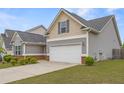 Charming two-story home with gray siding, well-kept lawn, and a spacious two-car garage, perfect for families at 256 Bollen Ln, Hiram, GA 30141