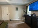 Spacious bedroom featuring a large TV and modern decor, perfect for relaxing at 220 Cameron Ways, Covington, GA 30016