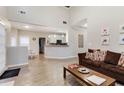 Bright living room boasts neutral walls, wood floors, and a cozy seating area at 220 Cameron Ways, Covington, GA 30016