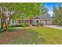 Beautiful brick home with mature trees and well-maintained lawn at 4508 Club House Dr, Marietta, GA 30066