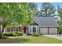 Beautifully landscaped brick home with a two-car garage and bay window at 4508 Club House Dr, Marietta, GA 30066