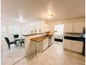 Bright kitchen with white cabinets, modern appliances, and eat-in area at 4590 Galleon Xing, Decatur, GA 30035