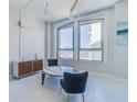 Bright living room featuring large windows, modern furniture, and elegant decor at 20 Marietta Nw St # 15D, Atlanta, GA 30303