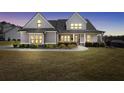 Charming two-story home featuring a well-manicured lawn and traditional architectural design, perfect for families at 220 Alcovy Reserve Way, Covington, GA 30014