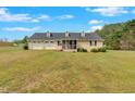Charming home featuring a large front yard and a convenient two-car garage at 40 L Z Jackson Road, Bowdon, GA 30108
