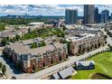 Aerial view of the building shows the pool, fitness center, and city skyline in the background at 400 17Th Nw St # 2125, Atlanta, GA 30363