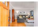 A light and airy living room features hardwood floors, crown molding, and a comfortable gray sectional sofa at 1157 Hancock Ne Dr, Atlanta, GA 30306