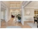 Spacious foyer featuring wainscoting, hardwood floors and staircase to the upper level at 125 Stoney Ridge Dr, Alpharetta, GA 30022