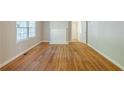 Bright living room boasts hardwood floors, a fireplace, and lots of space for entertaining or relaxing at 1328 Lockhaven Sw Cir, Atlanta, GA 30311