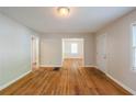 Open-concept living room features pristine hardwood floors and a seamless transition to other rooms at 1328 Lockhaven Sw Cir, Atlanta, GA 30311