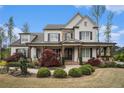 Captivating home with stone accents, black shutters, and a cozy covered porch perfect for relaxation and outdoor enjoyment at 3039 Malbec Vly, Acworth, GA 30101