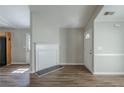 Bright living room features new wood flooring and fresh neutral paint at 2212 Butner Sw Rd, Atlanta, GA 30331