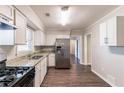 Renovated kitchen features stainless steel appliances, granite countertops, and tile backsplash for a luxurious feel at 2345 Leith Ave, Atlanta, GA 30344
