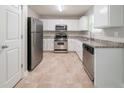 Well-lit kitchen with stainless steel appliances, ample cabinet space, and neutral countertops at 3568 Oakshire Se Way, Atlanta, GA 30354