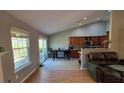 A dining area adjacent to the kitchen with a sliding glass door, promoting indoor/outdoor living at 1235 Jasmine Green Ct, Dacula, GA 30019