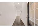 Hallway with wood floors and a glass front door at 290 Silver Moon Drive # 111, Loganville, GA 30052