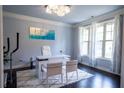 Well-lit office with large windows, a modern desk setup, and sleek decor for a productive atmosphere at 552 Warrenton Run Dr, Sugar Hill, GA 30518