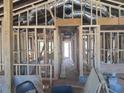 Interior framing of a room under construction, showcasing exposed beams and ductwork at 110 Dahlia Nw Ave, Atlanta, GA 30314