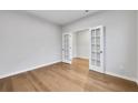 Bright office space featuring hardwood floors and elegant French doors at 6108 Marigold Way, Atlanta, GA 30349