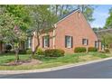 This brick home has manicured landscaping and black shutters at 1817 Bedfordshire Dr, Decatur, GA 30033