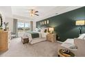 Main bedroom features modern decor, tray ceiling, and lots of natural light at 310 Silver Moon Drive # 111, Loganville, GA 30052