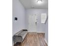Inviting entryway with wood floors, bench seating, and a bright, welcoming ambiance at 1929 Millstream Holw, Conyers, GA 30012