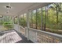 Inviting back porch with views of a serene wooded area, ideal for relaxing at 280 Old Carrollton Rd, Carrollton, GA 30116