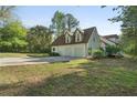 Spacious garage with a large driveway, situated on a green property at 280 Old Carrollton Rd, Carrollton, GA 30116