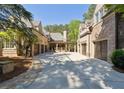 Spacious driveway leading to multiple garage doors, providing ample parking at 811 Flathead Pass, Suwanee, GA 30024