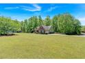 Sprawling lawn surrounds this well-maintained brick home, offering ample outdoor space and curb appeal at 4309 Milford Pl, Hoschton, GA 30548